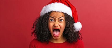 A woman in a santa hat is making a face photo
