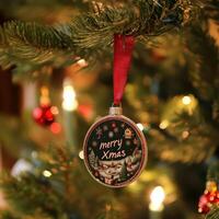 A christmas ornament hanging from a christmas tree photo