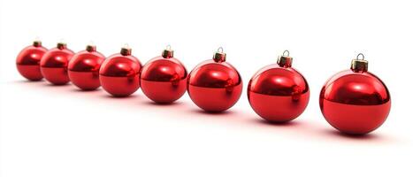 A row of red christmas balls on a white background photo