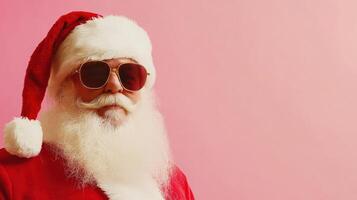 A santa claus wearing sunglasses and a red suit photo