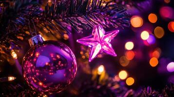 Purple christmas decorations on a tree photo