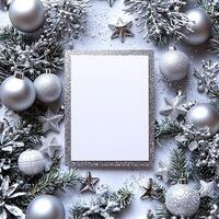 Blank Christmas card surrounded by metallic silver decorations festive and elegant photo