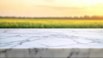 Natural Marble Surfaces with Soft Bokeh Lighting. A serene landscape featuring a blurred sunset over green fields, with a marble countertop in the foreground. photo