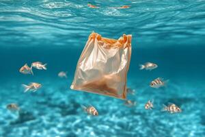 Plastic bag floating in the ocean with fish photo