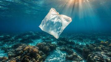 Plastic bag floating in the ocean photo