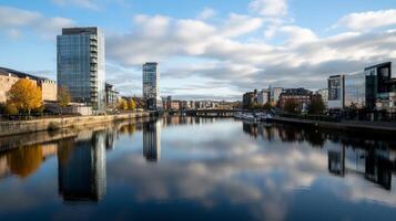 A river with buildings and trees on either side photo