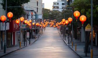 A quiet street adorned with glowing lanterns, creating a festive atmosphere. photo