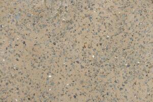 Close up view of small stones embedded in the cement Karlin, Prague photo