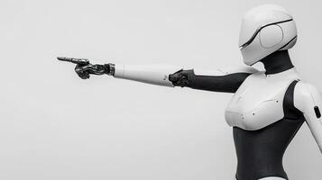 The humanoid robot points forward, demonstrating its precision and cutting-edge design in a simple, modern setting photo