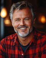 The man beams with joy, showcasing a welcoming smile in a warm, inviting environment photo