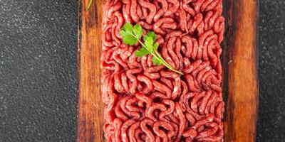 minced meat fresh beef, pork meat tasty eating cooking meal food snack on the table copy space food background rustic top view photo