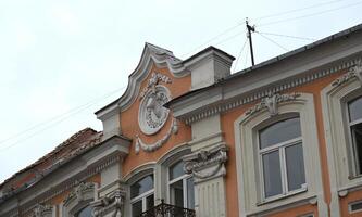 a building with a clock on the side of it photo