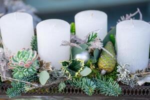 Advent wreath with four candles. Christmas ball and decorations photo