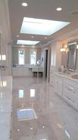 A large bathroom with marble floors and white cabinets photo