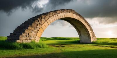 An arch in the middle of a grassy field photo