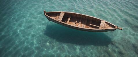 An aerial view of a boat floating in the ocean photo