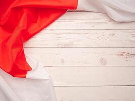 Top view of the Japan flag on a wooden table with space for text photo