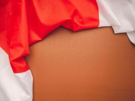 Top view of the Japan flag on a brown background with space for text photo