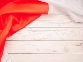 Top view of the Japan flag on a wooden table with space for text photo