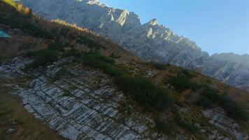 FPV drone flying close to the sharp mountain cliffs and Lago di Sorapis. Italy. video