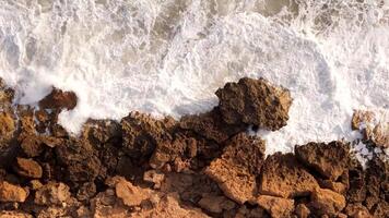 Aerial view seashore cliffs wave crashing on rocks. Sardinia, Italy. video
