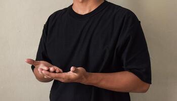Sign language with hand gestures speaking body language with young man photo