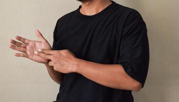 Raised man's hands being raised while showing word train using language of deaf people photo
