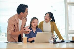A team of smart young employees focused on discussing work, sharing helpful ideas in a modern office photo