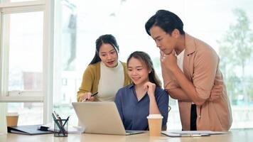 A team of smart young employees focused on discussing work, sharing helpful ideas in a modern office photo