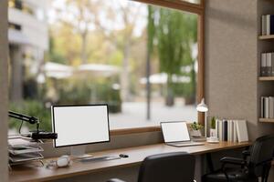 A modern, minimalist radio podcast office featuring a computer and a laptop mockups and a microphone photo