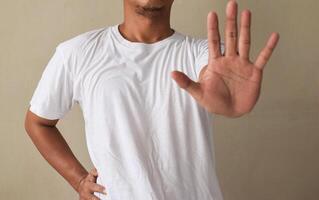 Man showing a refuse hand gesture sign photo