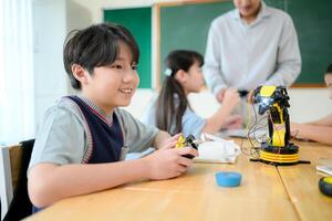 STEM Class, Teacher and students in basic engineering classroom photo