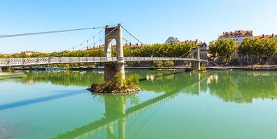 Old Passerelle du College bridge over Rhone river in Lyon, France photo