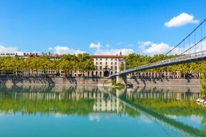 Cityscape of Lyon, France with reflections in the water photo