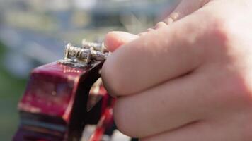 Turning Keys to the Machine Heads of a Classical Guitar for Tuning video