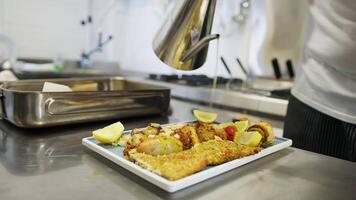 Addition of Extra Virgin Olive Oil to a Second Course of Breaded Fish video