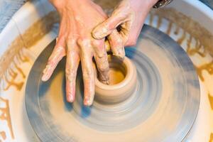 Pottering - creating a clay cup in process photo
