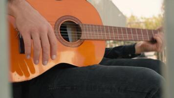 Street Composer Writes His First Song In A Park With Classical Guitar video