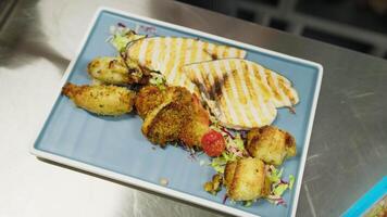 Chef Prepares a Second Course with Breaded Swordfish Rolls for a Restaurant video