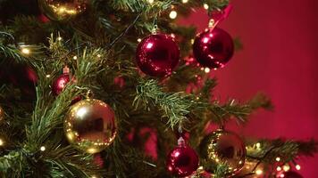 Christmas Baubles On Tree With Red Background In A Room video