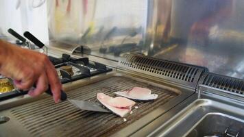 Chef Turns Swordfish On The Grill At A Restaurant video