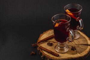 Warm fresh mulled wine with spices for a festive winter evening photo