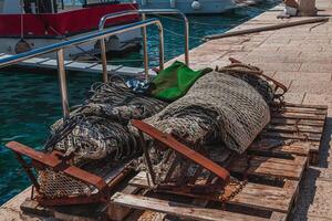 03.07.24 Porec Croatia Fishing nets for fishermen's boat at the pier photo
