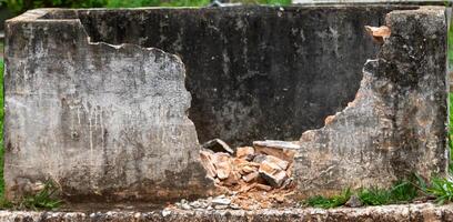Old crumbling broken brick wall rustic texture, abandoned, mysterious photo