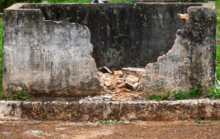 Old crumbling broken brick wall rustic texture, abandoned, mysterious photo