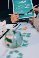 Carbon offset price report CO2 emission. Future growth Net zero waste in ESG ethical SME office protect climate change global warming social issues project. Group of asia people Eco friendly SDGs plan photo