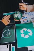 Carbon offset price report CO2 emission. Future growth Net zero waste in ESG ethical SME office protect climate change global warming social issues project. Group of asia people Eco friendly SDGs plan photo