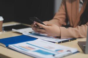 business documents businessman check legal document review Prepare documents or analysis reports, tax items, accounting documents, data contracts, office partner agreements. photo