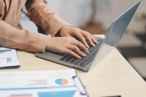 business documents businessman check legal document review Prepare documents or analysis reports, tax items, accounting documents, data contracts, office partner agreements. photo