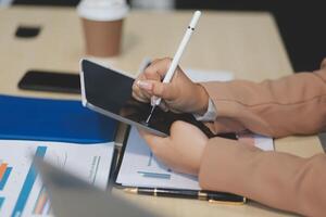 business documents businessman check legal document review Prepare documents or analysis reports, tax items, accounting documents, data contracts, office partner agreements. photo